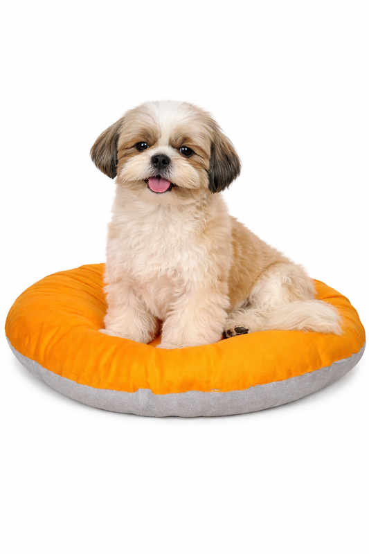 Round donut-style pet bed, orange top cushion, grey base